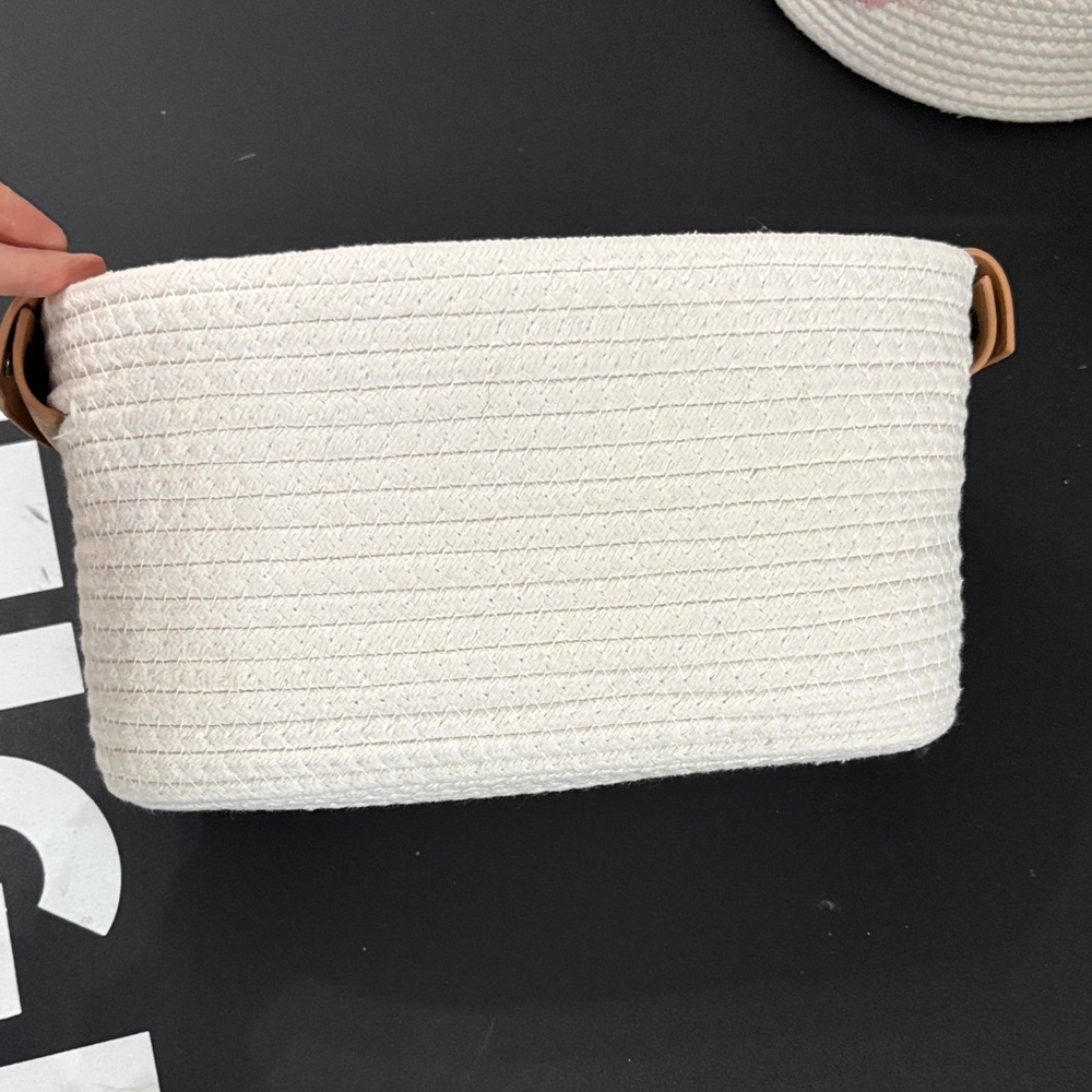 Woven basket with leather handles